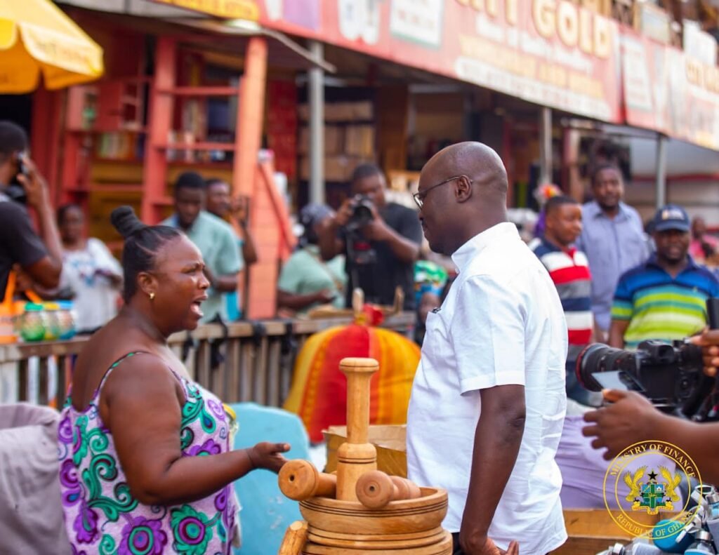 Dr Cassiel Ato Forson, Minister of Finance interacting with traders at the Makola Market