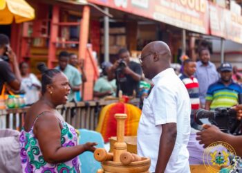 Dr Cassiel Ato Forson, Minister of Finance interacting with traders at the Makola Market