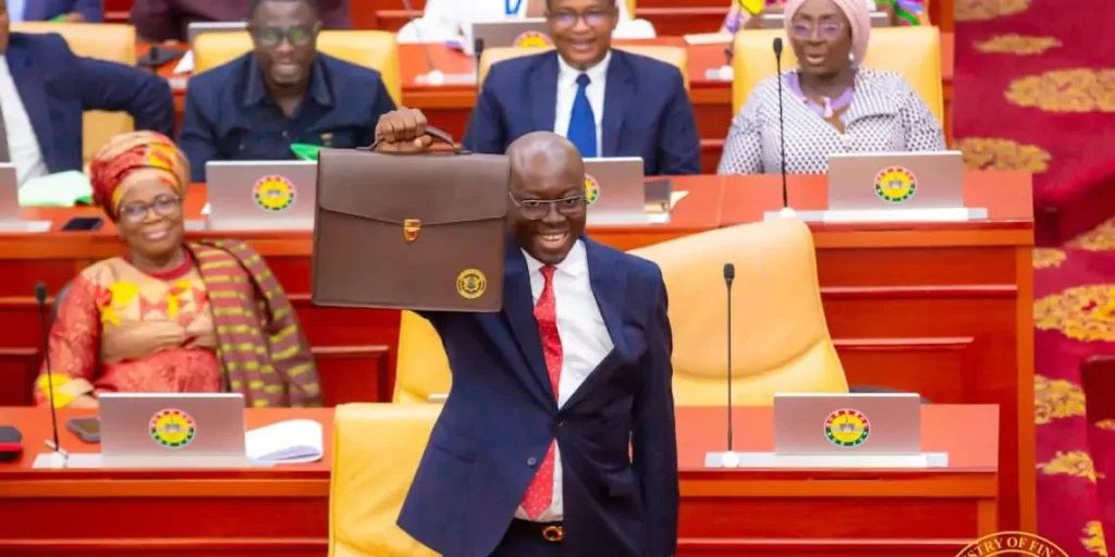 Dr Cassiel Ato Forson Ghanas Minister of Finance Holding a Made in Ghana Bag