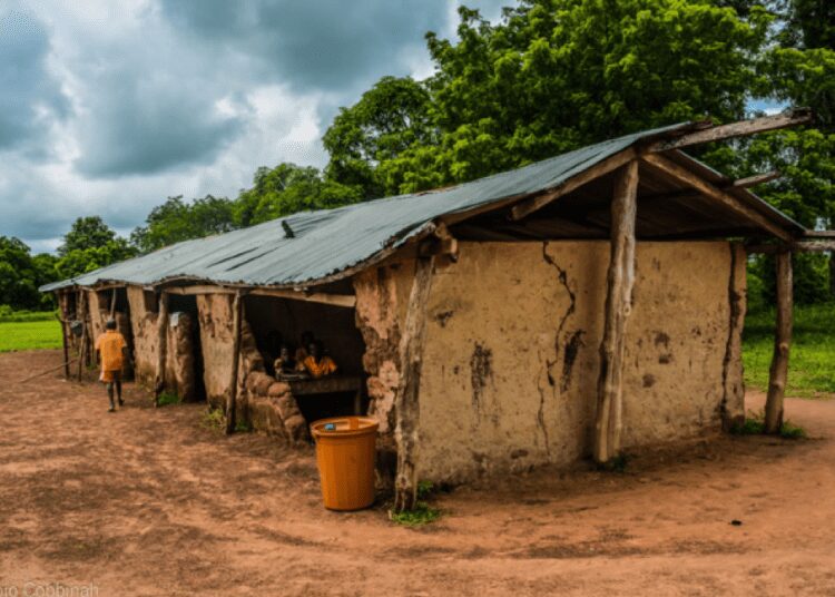 Learners inside an Educational Infrastructure in a dilapidated State with