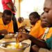Some basic school children in Ghana eating