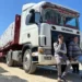 Trucks carrying humanitarian aid line up on the Egyptian side of the Rafah border crossing with the Gaza Strip