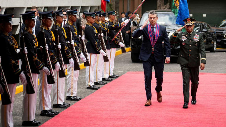 US Defense Secretary Pete Hegseth and Philippine Army Chief of Staff Romeo Brawner Jr. inspect honor guards at Camp Aguinaldo in the Philippines