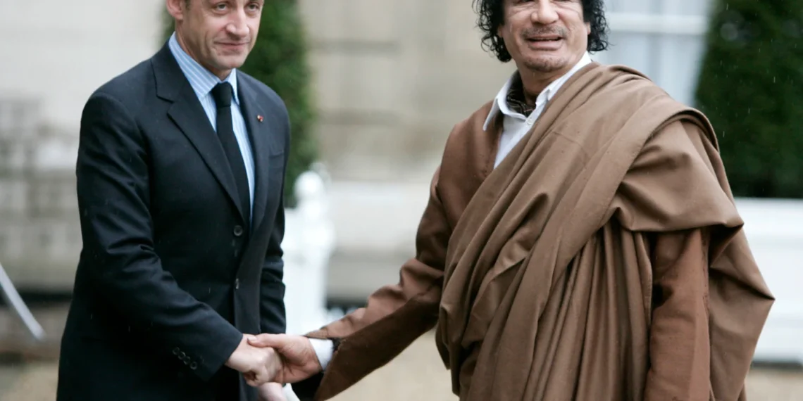 Former President Nicolas Sarkozy and late Muammar Gadhafi