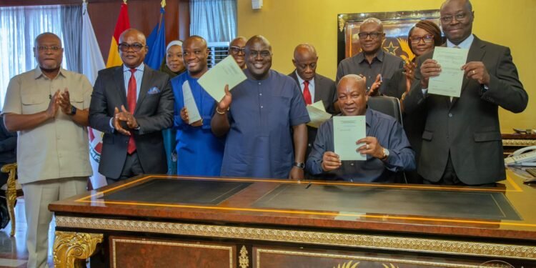 Picture of HE President John Dramani Mahama and other Government Officails signing landmarks bills