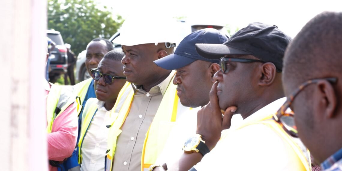 Roads Minister Hon. Governs Kwame Agbodza inspecting the architectural design of the Afraim Plains River Bridge
