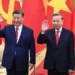 Vietnam's communist party General Secretary Tô Lâm (R) and Chinese President Xi Jinping (L) wave during a meeting at the Office of the Party Central Committee in Hanoi as China, Vietnam Sign Dozens Of Agreements