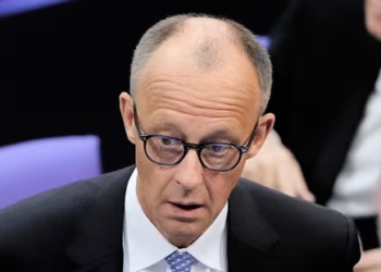 Friedrich Merz reacts after he was not elected new Chancellor in the first voting process at the parliament Bundestag in Berlin.