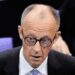 Friedrich Merz reacts after he was not elected new Chancellor in the first voting process at the parliament Bundestag in Berlin.