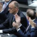 Leader of the Christian Democrats Friedrich Merz is applauded after being elected new chancellor at the German federal parliament, Bundestag, at the Reichstag building in Berlin, Germany, Tuesday, May 6, 2025.
