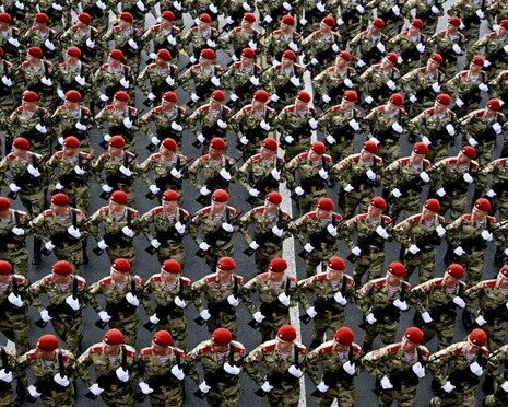 Xi Begins Four-Day Russia Visit 3 Troops march towards Red Square during a VE day rehearsal in Moscow.