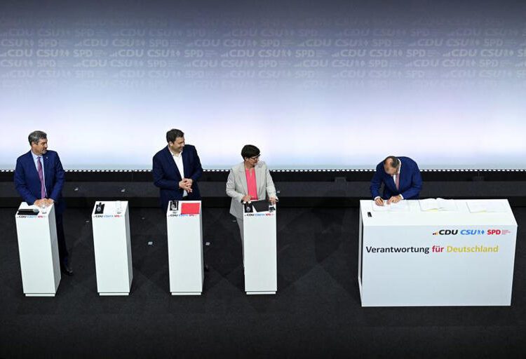 Germany’s Mainstream Parties Sign Coalition Deal 1 Incoming German Chancellor and leader of the Christian Democratic Union (CDU) Friedrich Merz signs the coalition government agreement between CDU, CSU and SPD, as Christian Social Union (CSU) leader and Bavarian Premier Markus Soeder, Designated German Vice Chancellor and Designated Finance Minister Lars Klingbeil and Social Democratic Party of Germany (SPD) co-leader Saskia Esken look on, at the Gasometer in Berlin, Germany May 5, 2025.