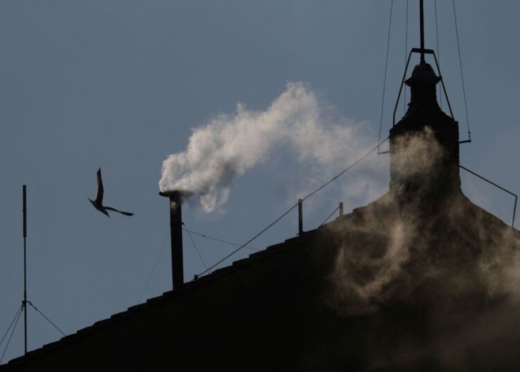White smoke rises from the chimney on the Sistine Chapel on Thursday
