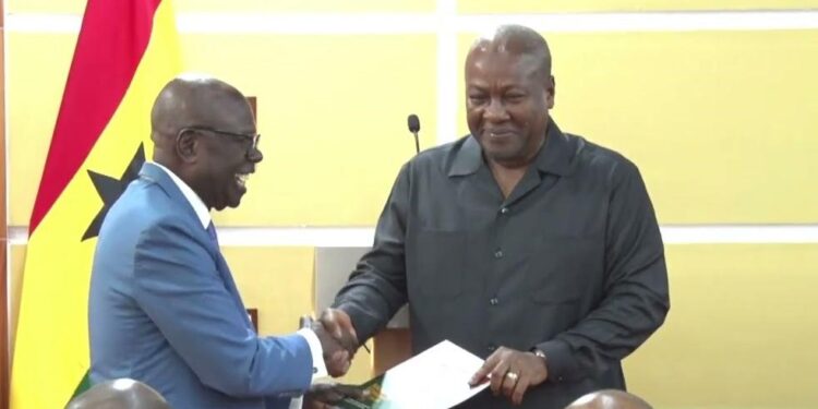 Dr. Ishmael Yamson, National Economic Dialogue Planning Committee Chair presents final draft report to President Mahama