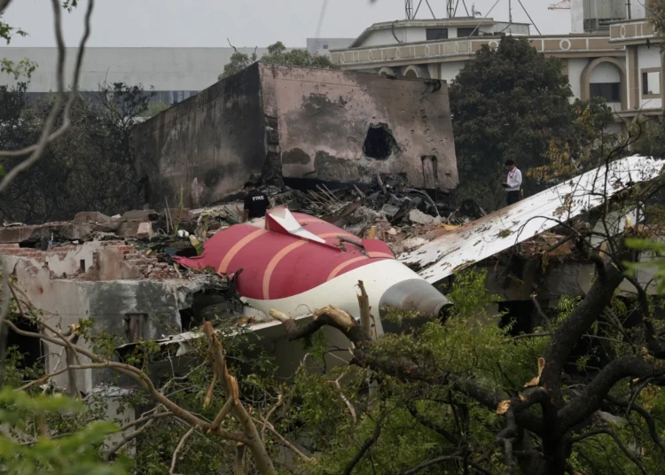 Air India Black Box Recovered From Crash Site 1 Parts of an Air India plane that crashed on Thursday are seen on top of a building in Ahmedabad, India, Friday, June 13, 2025.