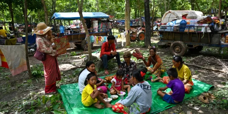 Thai-Cambodian clashes force 100,000 into shelters amid rising tensions
People who fled their homes near the Cambodia-Thailand border rest in the grounds of a pagoda in Cambodia’s Oddar Meanchey province