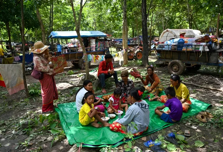 Thousands Evacuated As Thailand-Cambodia Cross-border Fighting Enter Second Day 1 Thai-Cambodian clashes force 100,000 into shelters amid rising tensions
People who fled their homes near the Cambodia-Thailand border rest in the grounds of a pagoda in Cambodia’s Oddar Meanchey province