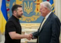 Ukrainian President Volodymyr Zelenskyy, left, shakes hands with United States Special Envoy for Ukraine and Russia, Joseph Keith Kellogg in Kyiv, Ukraine, Monday, July 14, 2025.