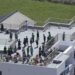 Earthquake Off Russia's Coast Triggers Evacuations Across Pacific 14 An aerial photo shows people gathered on the rooftops of buildings near the coast in Oamishirasato City, Chiba Prefecture, Japan, on Wednesday.