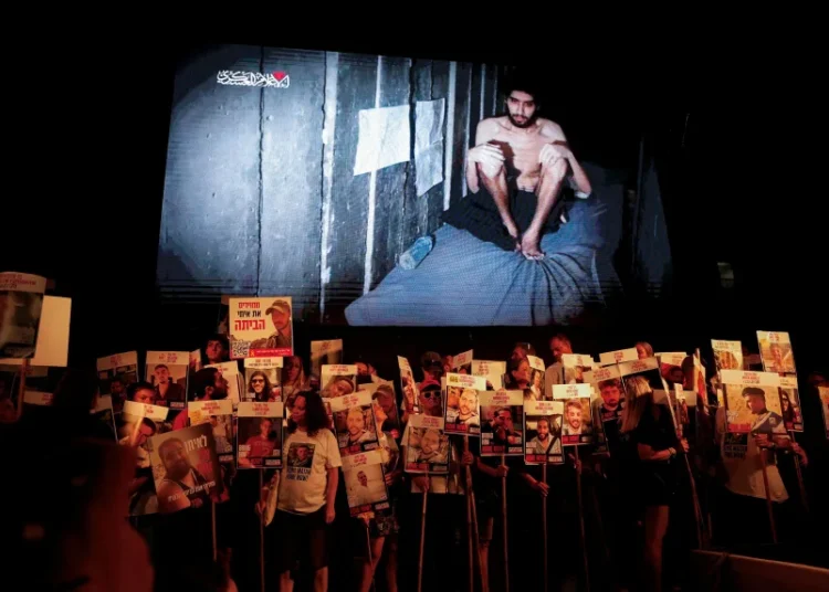 A video released by Hamas of hostage Evyatar David is displayed at a protest in Tel Aviv, Israel.