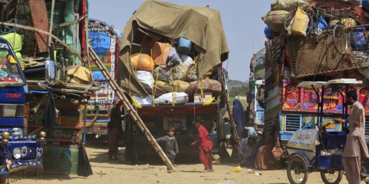 Pakistan Resumes Forced Expulsions Of Afghan Refugees 1 Afghan refugee children play next to trucks loaded with their family’s belongings as they wait to return Afghanistan along a highway in Landi Kotal, Pakistan, April 9, 2025.