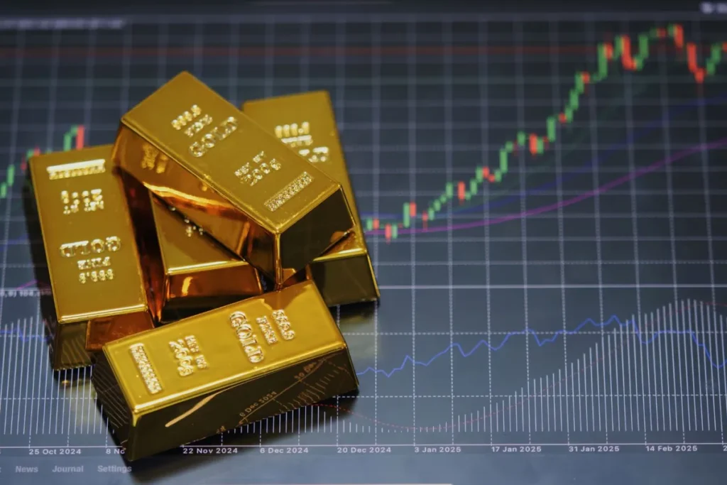 Gold Prices Rise on Powell's Rate-Cut Signal 4 gold bars on financial chart showing upward trend