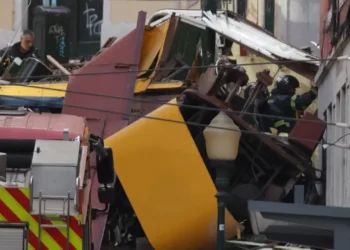 Police and firefighters work at the site of a funicular accident in Lisbon.