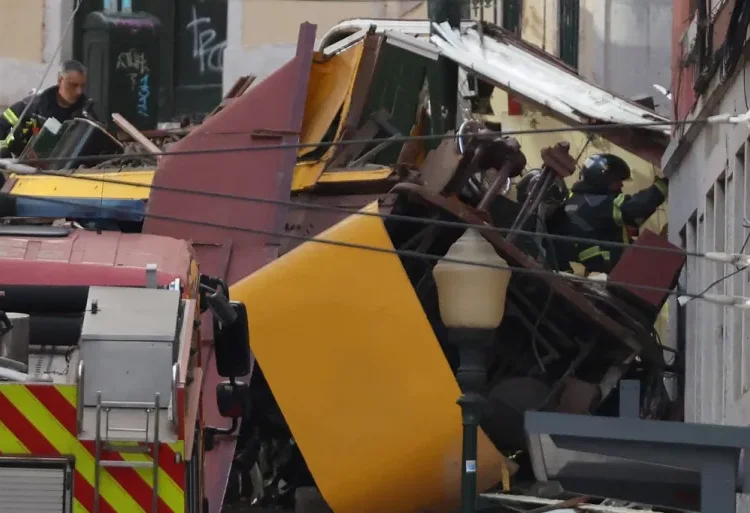Portugal Mourns After Lisbon Funicular Accident Kills 17 1 Police and firefighters work at the site of a funicular accident in Lisbon.
