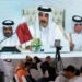 Qatar's Emir Vows Economic Resilience Amid Regional Crisis 13 Journalists watch on a screen at the media center as Sheikh Tamim bin Hamad Al Thani, the emir of Qatar, speaks