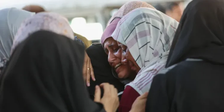 UN Report Confirms Israeli Genocide in Gaza 1 Palestinian women grieve for a slain loved on outside Gaza City’s al-Shifa