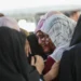 UN Report Confirms Israeli Genocide in Gaza 14 Palestinian women grieve for a slain loved on outside Gaza City’s al-Shifa