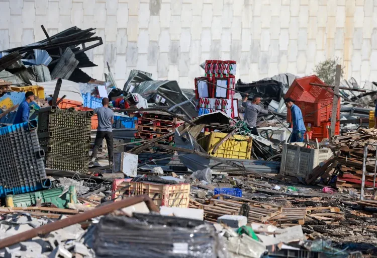 Israeli Forces Storm West Bank In Wake Of Jerusalem Shooting Attack 1 Palestinian vendors salvage items from the rubble after the Israeli army demolished 16 shops at the produce market in Beita village, south of Nablus in the occupied West Bank.