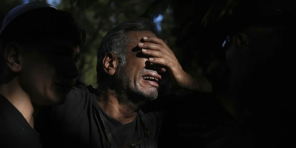 A relative mourns during the funeral of slain hostage Idan Shtivi, whose body was recovered in an Israeli military operation in the Gaza Strip, in Kfar Maas, Israel, Monday, Sept. 1, 2025.