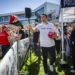 Charlie Kirk hands out hats before speaking at Utah Valley University in Orem, Utah, Wednesday, Sept. 10, 2025.