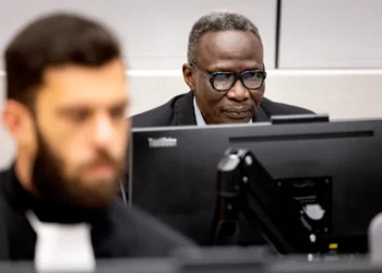 Ali Muhammad Ali Abd-Al-Rahman, also known as Ali Kushayb, right, attends a hearing in his trial at the International Criminal Court in The Hague in October 2023.