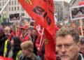 People march with signs during a general strike in Brussels, 14 October, 2025.