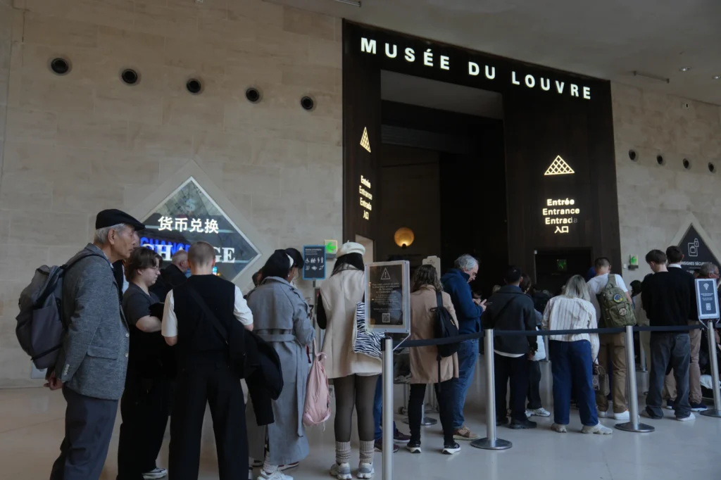 Louvre Director Admits Security Failure 4 Visitors queue inside the Louvre museum three days after historic jewels were stolen in a daring daylight heist, Wednesday, Oct. 22, 2025 in Paris.
