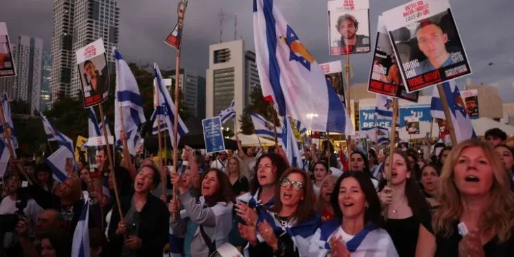 People applauding and cheering in Tel Aviv’s ‘Hostage Square’ as news breaks that the first seven captives are on their way back to Israel.