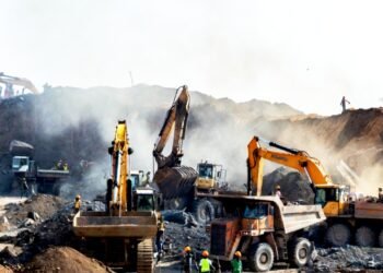 Heavy machinery and diesel exhaust at a large-scale gold mine