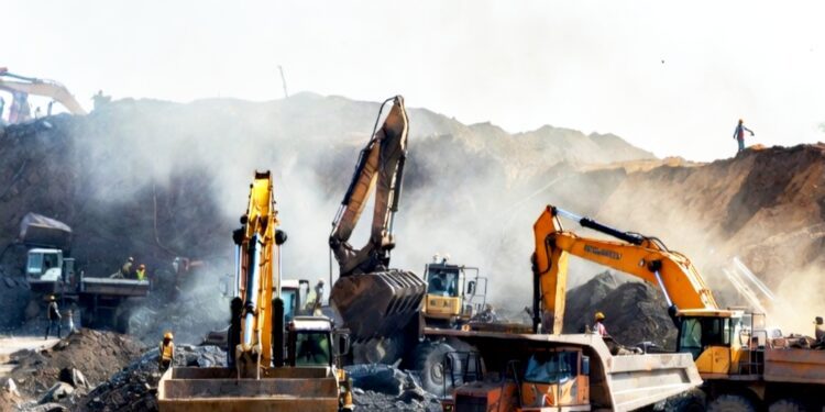 Heavy machinery and diesel exhaust at a large-scale gold mine
