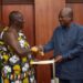 Asantehene Otumfuo Osei Tutu II (L) handing over the Mediation Report to President John Dramani Mahama (R)
