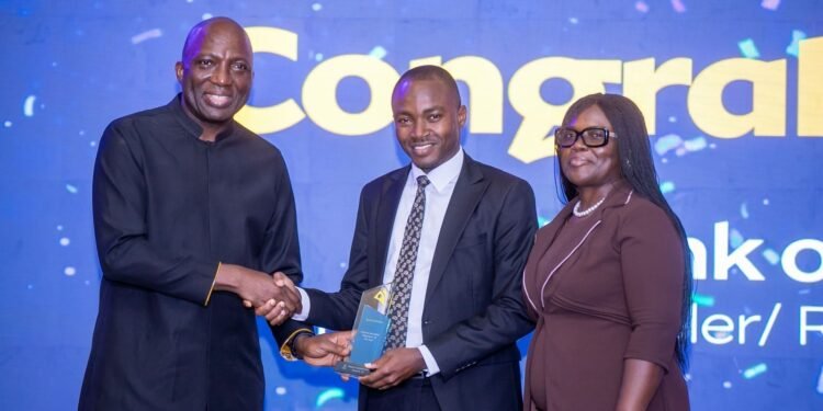 CEO of MobileMoney LTD presenting the award for Regulator of the Year to the Bank of Ghana