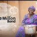 Global Investors Back $200m Bond for Cleaner Cooking Access in Ghana 11 A smiling Ghanaian woman in vibrant purple traditional attire sits proudly beside a modern clean cookstove with a large silver pot.