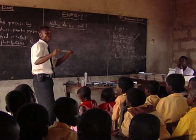 Teacher In Class with Pupils