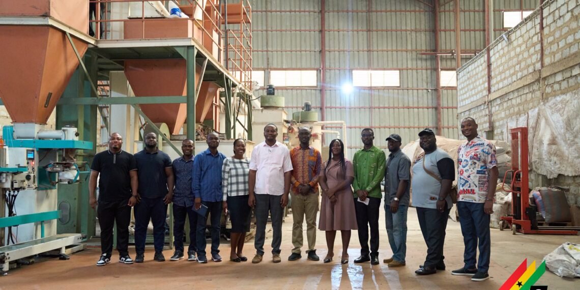 Kwame Kesse-Agyepong, GIPC Deputy Director, at Akwaaba Feeds in Bawjiase, with Representatives