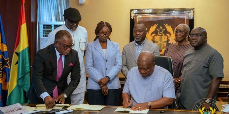 President Mahama Signs Five Key Bills Into Law 1 President John Dramani Mahama signing the five Bills as passed by Parliament