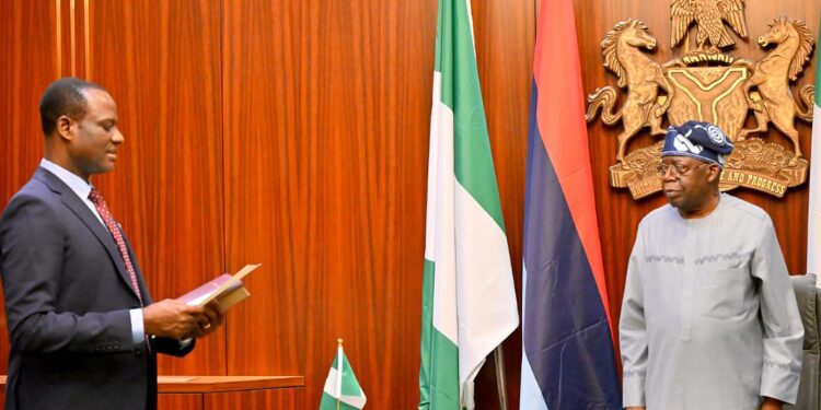 Nigeria’s Finance Minister Pledges Execution of Tax Reforms 1 President Bola Tinubu administers the oath of office on Mr Taiwo Oyedele as the new Minister of State for Finance at the Aso Rock Presidential Villa, Abuja,