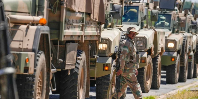 South African National Defense Forces deploy in the Riverlea township of Johannesburg