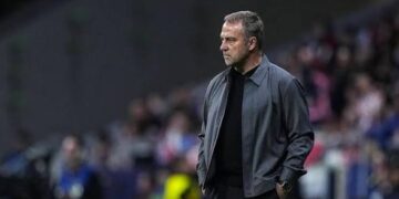 Barcelona Manager Hansi Flick watches on from the touch line