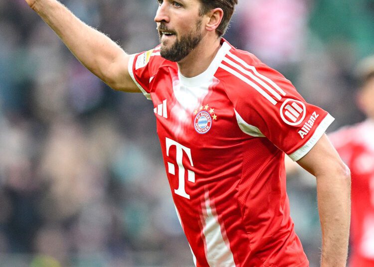 Bayern Edge Real Madrid in Thriller to Book UCL Semi-Final Spot 1 Harry Kane celebrates scoring Bayern's equalizer